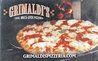 a pizza with the words grimald's on it