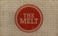 the melt logo on a brick wall